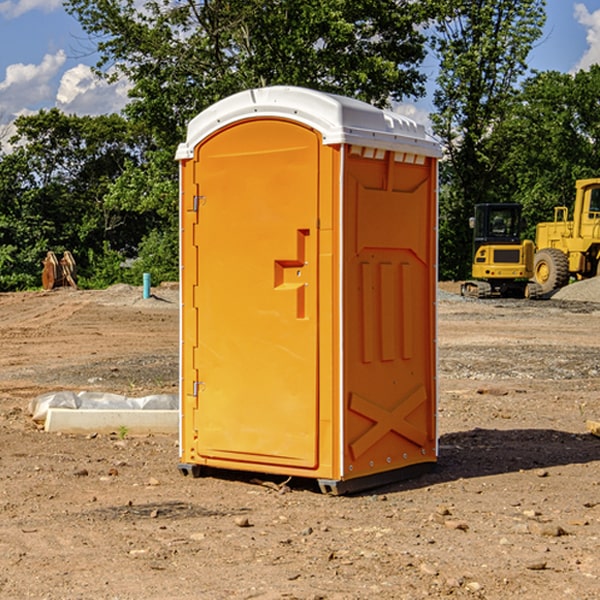 what is the cost difference between standard and deluxe porta potty rentals in Dinero